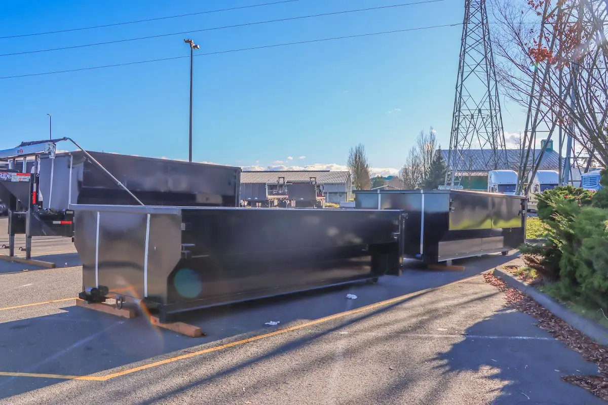 Roll-off dumpster ready for waste disposal at job site for Demolition Dumpster Rental in Monson